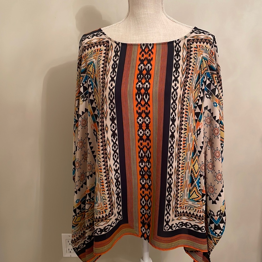 Multi color Indian pattern top, made with wide sleeves, is a size L.